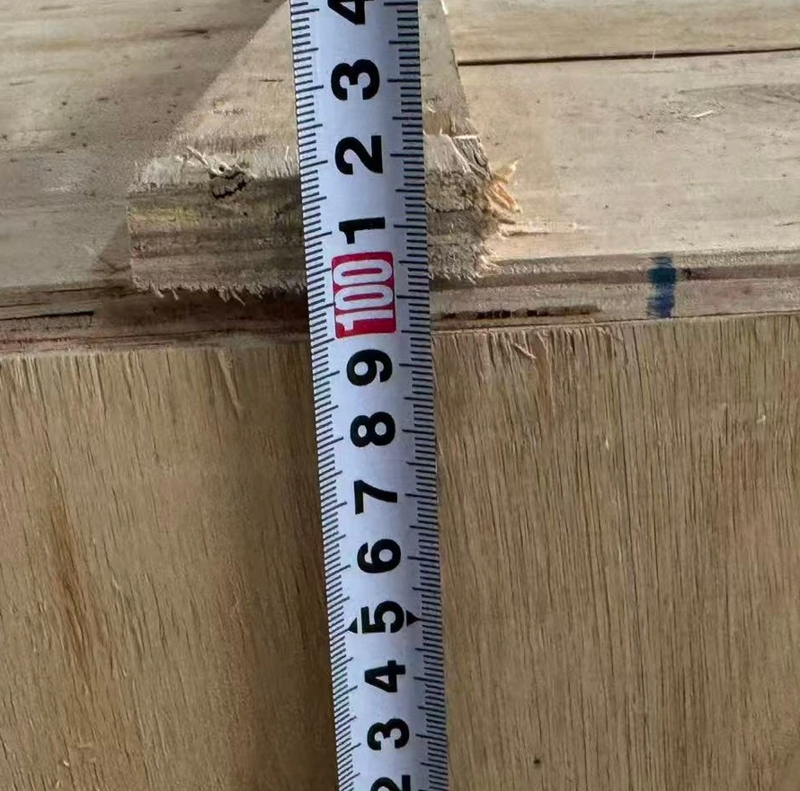 Ruler photograph alongside the height of an anonymized wooden crate